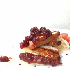 A picture of Pork Loin in Cranberry Sauce with Spaghetti.