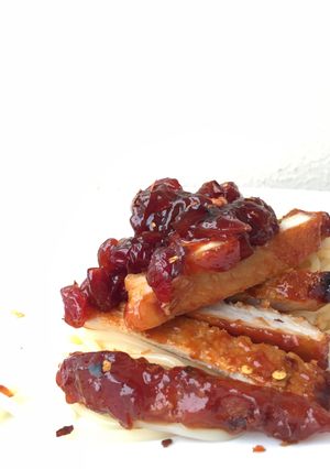 A picture of Pork Loin in Cranberry Sauce with Spaghetti.