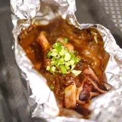 A picture of Preparing Foil-Baked Squid.