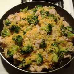 A picture of Pork with Broccoli and Rice.
