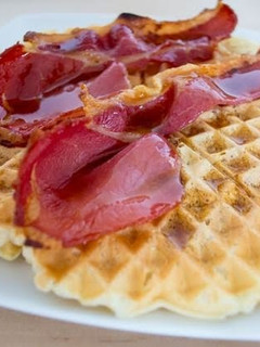 A picture of 'Twisted' waffles with bacon.