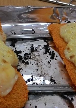 A picture of Creamy garlic cheese baked golden fish cake.