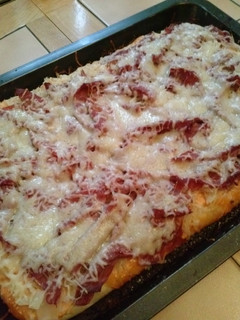 A picture of Corned Beef Reuben Pizza.