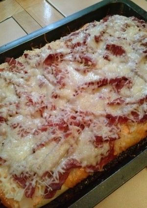 A picture of Corned Beef Reuben Pizza.