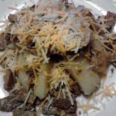 A picture of Steak Skillet over Baked Potato.