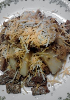 A picture of Steak Skillet over Baked Potato.