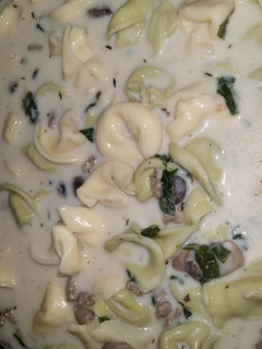 A picture of Creamy Tortellini Spinach Mushroom Soup with Turkey Sausage.