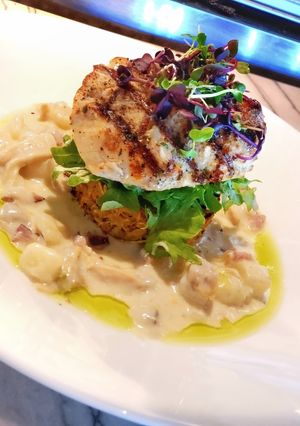 A picture of Grilled Fish with Awadhi Creamy Potato, Veggie Rosti & Greens.