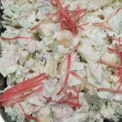 A picture of Apple salad with chicken cabbage.