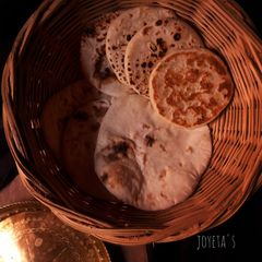A picture of Cheesy kulcha on tawa.