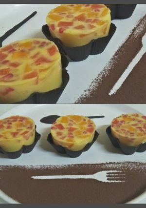 A picture of Mix fruits milk jelly pudding in chocolate basket.