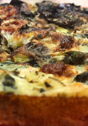 Una foto de Quiche de espinacas, setas y tomates cherry