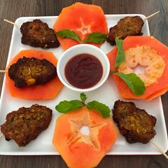 A picture of Leftover Sweet Corn Upma Christmas stick with papaya.