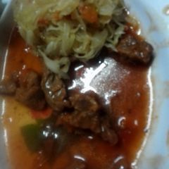 A picture of Stewed beef and saute cabbage.