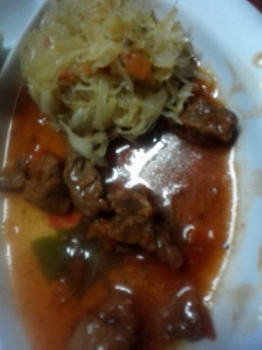 A picture of Stewed beef and saute cabbage.