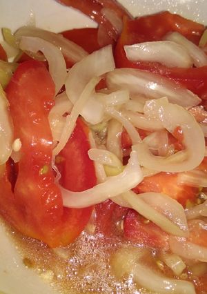 Una foto de Tomate con cebolla