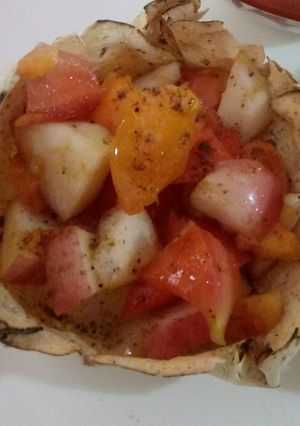 A picture of Tomato onion salad in papad katori.