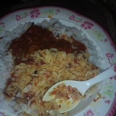 A picture of Rice & beans with stew.