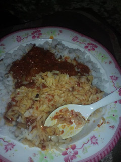 A picture of Rice & beans with stew.