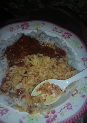 A picture of Rice & beans with stew.
