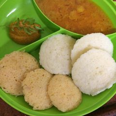 A picture of Mix veg Rava idli with sambhar and chutney.