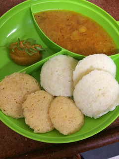 A picture of Mix veg Rava idli with sambhar and chutney.