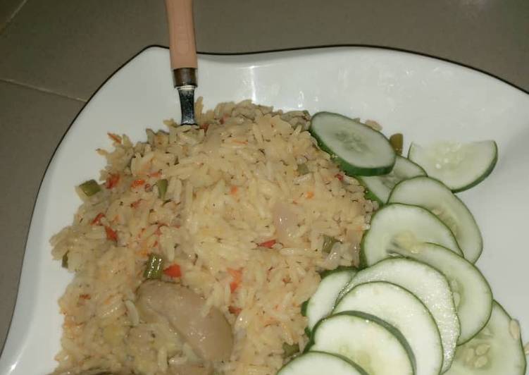 Step-by-Step Guide to Prepare Ultimate Jollof rice and cucumber