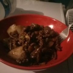 A picture of Minced beef with potatoes and red wine reduction.