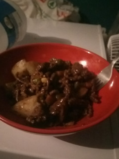 A picture of Minced beef with potatoes and red wine reduction.