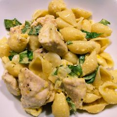 A picture of Pasta shells with spiced chicken and corn milk sauce.