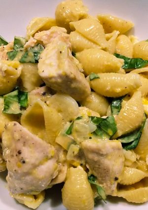A picture of Pasta shells with spiced chicken and corn milk sauce.