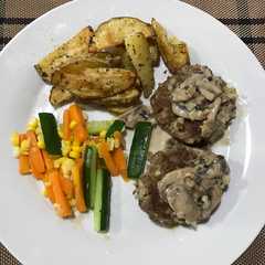 A picture of Grilled burger patties.