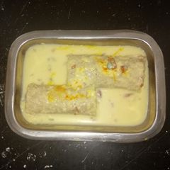 A picture of Bread Malai Roll Recipe | Instant Rabdi Malai Roll.
