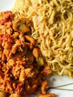 A picture of Noodles with mushroom egg sauce.
