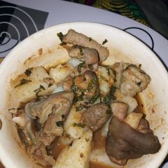 A picture of Boiled Yam with Goat meat and assorted meat peppersoup.