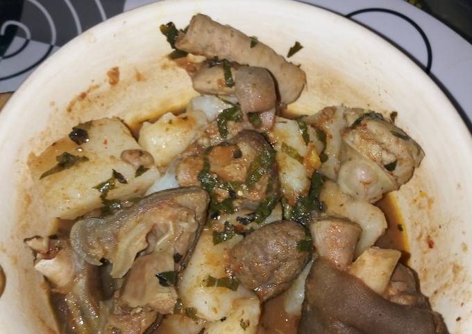 Boiled Yam with Goat meat and assorted meat peppersoup