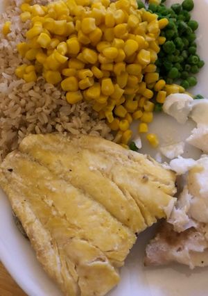 A picture of Double Poached Haddock with veg and rice.