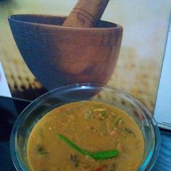 A picture of Cowpea beans , potato and brinjal Puli kulambu / tamarind based gravy.