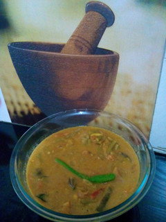 A picture of Cowpea beans , potato and brinjal Puli kulambu / tamarind based gravy.