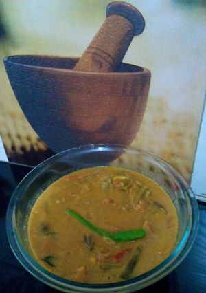 A picture of Cowpea beans , potato and brinjal Puli kulambu / tamarind based gravy.