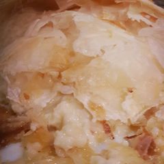 A picture of Brie cheese wrapped in phyllo pastry.