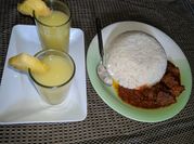 A picture of beef stew and rice