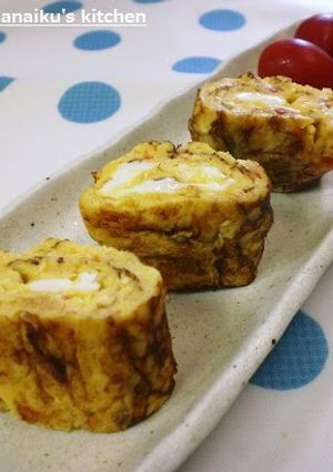 A picture of Tamagoyaki Japanese Omelets with Mayonnaise and Sweet Chili Sauce.