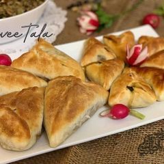A picture of Swiss_chard_pastry... Shuabiat_bie_selek.
