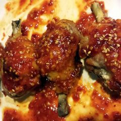 A picture of Korean BBQ chicken drumsticks.