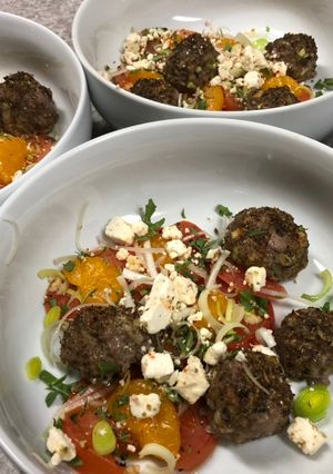 A picture of Mini Meatballs w/ Mandarin Orange Garlic Tomatoes.