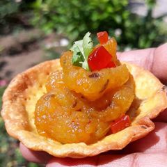 A picture of Puri tarts with pumpkin curry.