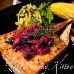 A picture of Salmon Steak With Olive Dill Sauce.