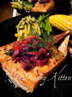 A picture of Salmon Steak With Olive Dill Sauce.