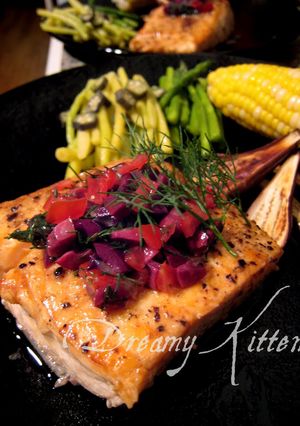 A picture of Salmon Steak With Olive Dill Sauce.
